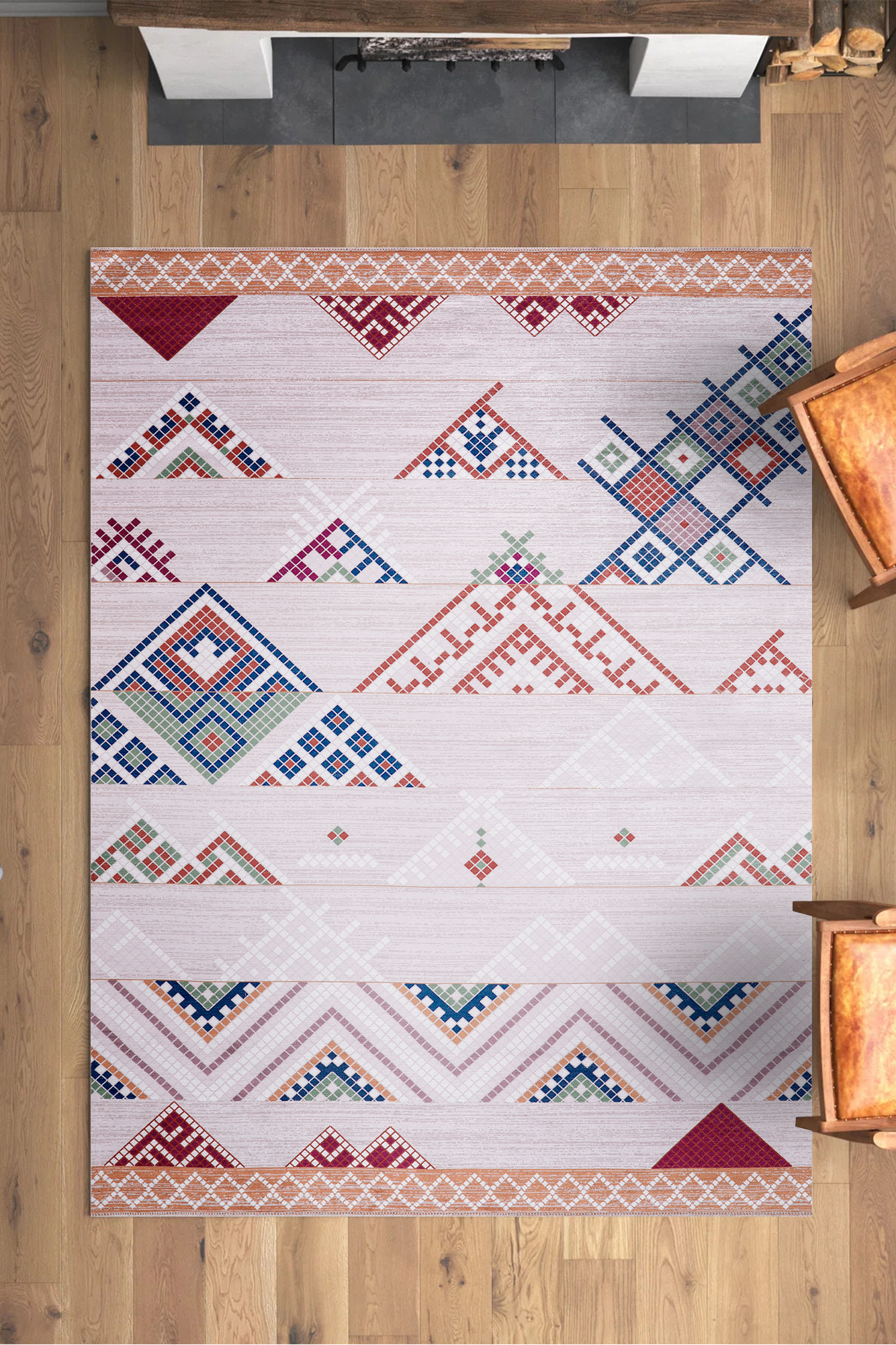 Geometric patterned rug on a wooden floor with furniture around